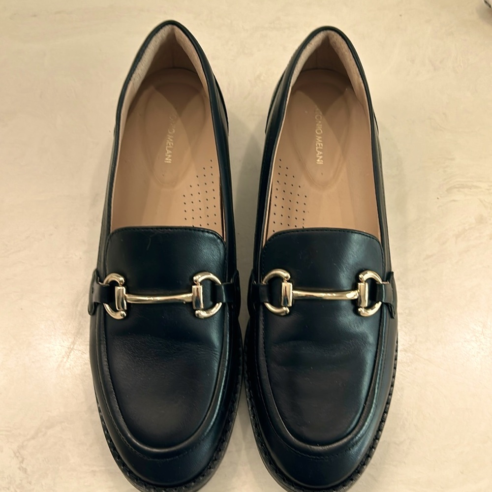 Antonia Melani black flats with gold-tone but